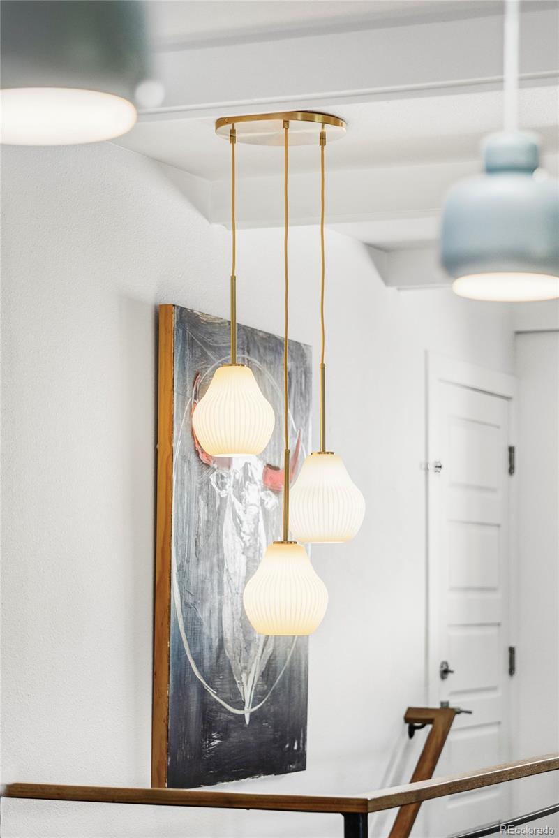 3370 Ward Road Wheat Ridge, CO 80033 - Photo 16 of 42 a bathroom with a mirror and a sink