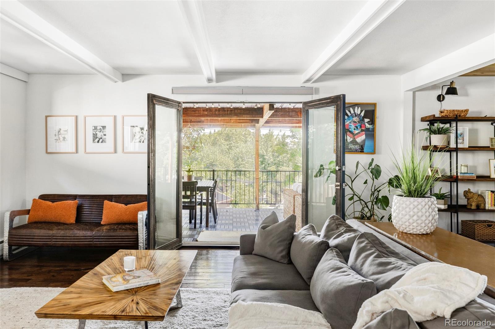 3370 Ward Road Wheat Ridge, CO 80033 - Photo 18 of 42 a living room with furniture and a large window