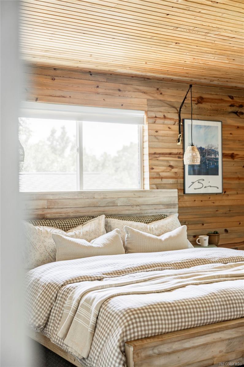3370 Ward Road Wheat Ridge, CO 80033 - Photo 21 of 42 a view of a bedroom with window