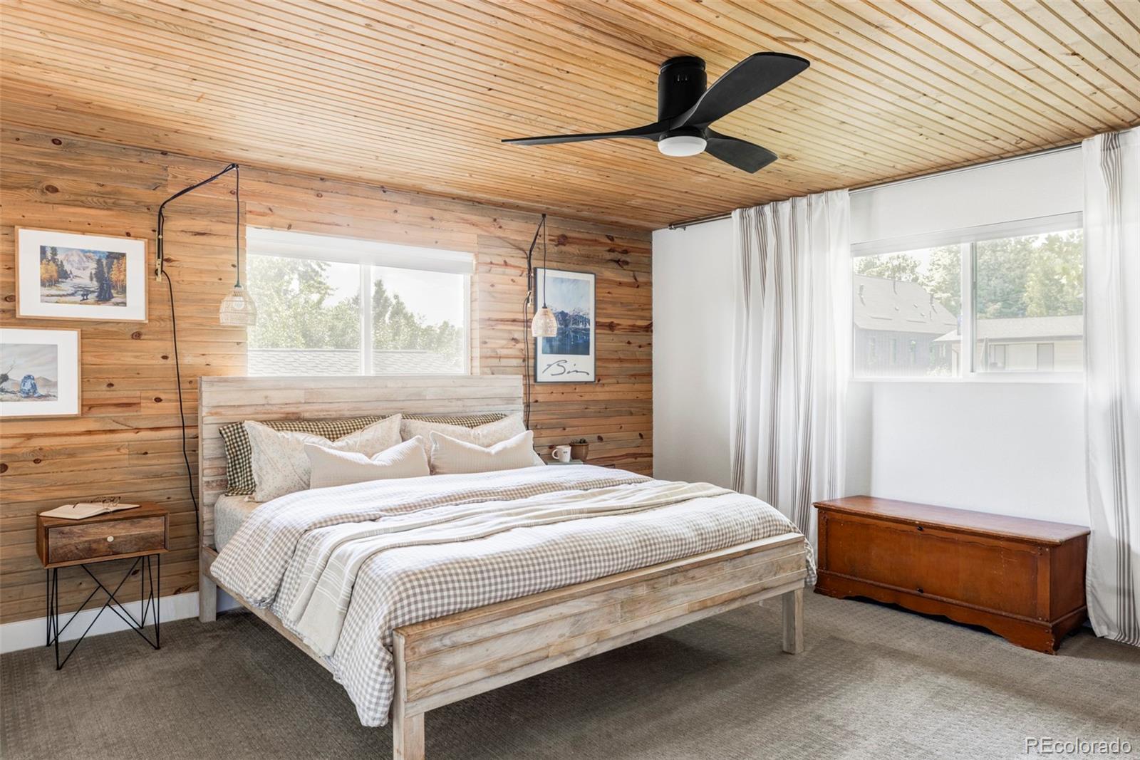 3370 Ward Road Wheat Ridge, CO 80033 - Photo 23 of 42 a bedroom with a bed next to a window