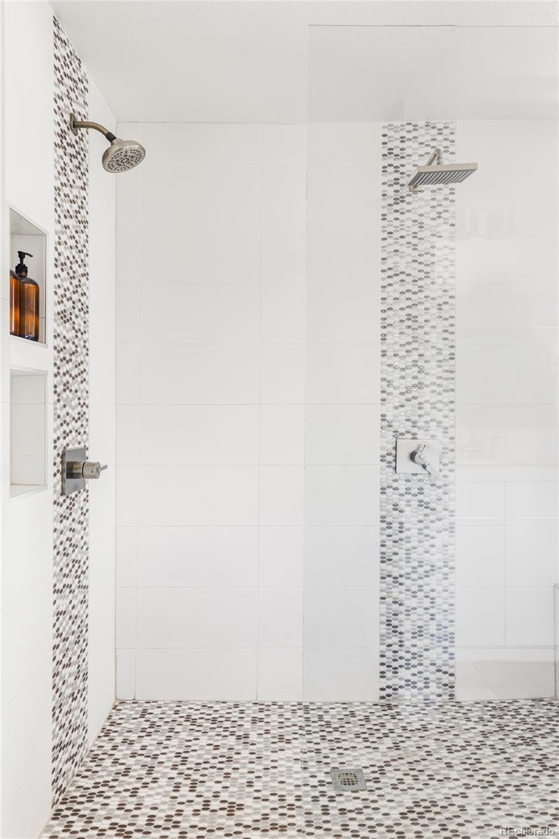 3370 Ward Road Wheat Ridge, CO 80033 - Photo 26 of 42 a bathroom with a shower