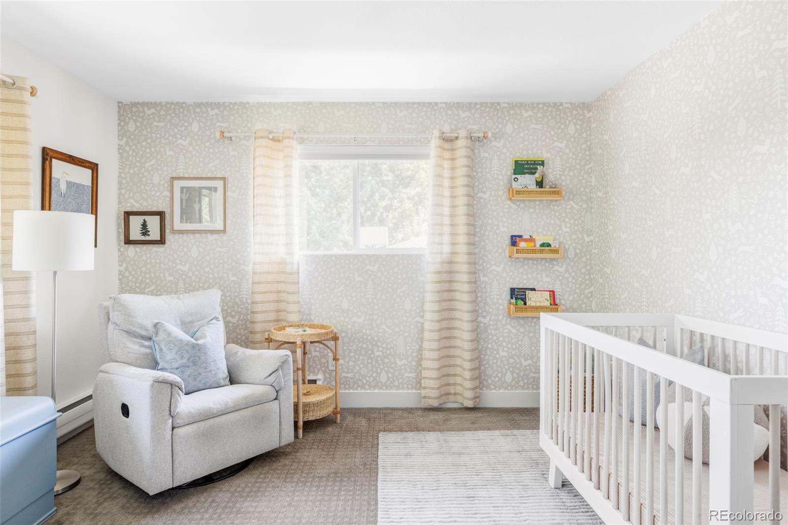 3370 Ward Road Wheat Ridge, CO 80033 - Photo 27 of 42 a living room with furniture and a window