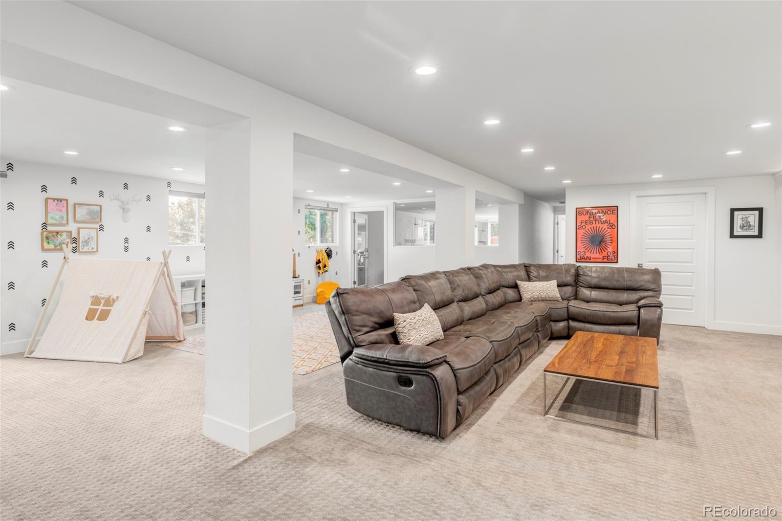 3370 Ward Road Wheat Ridge, CO 80033 - Photo 32 of 42 a living room with furniture and a table