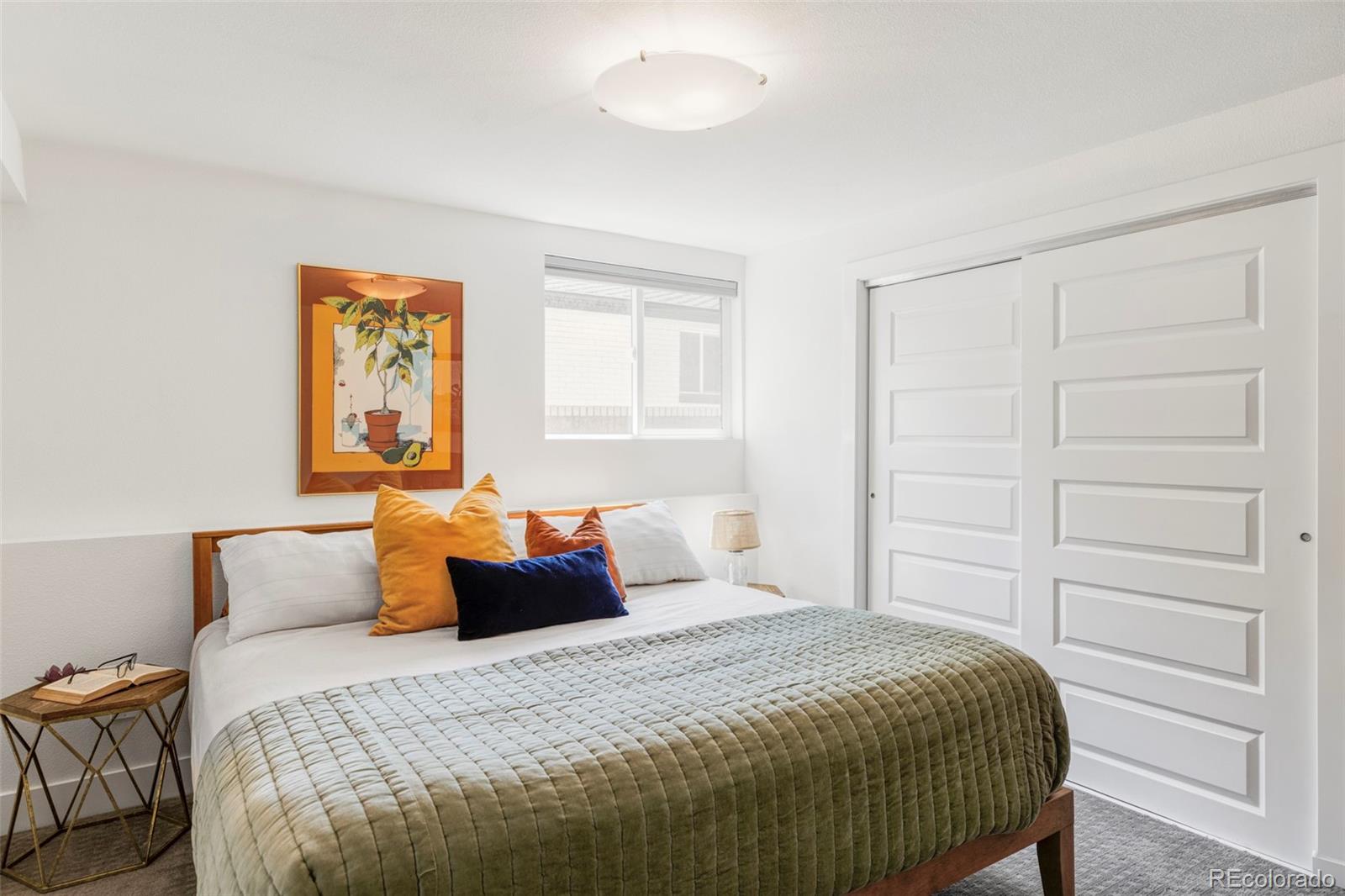 3370 Ward Road Wheat Ridge, CO 80033 - Photo 35 of 42 a bedroom with a bed and cabinet