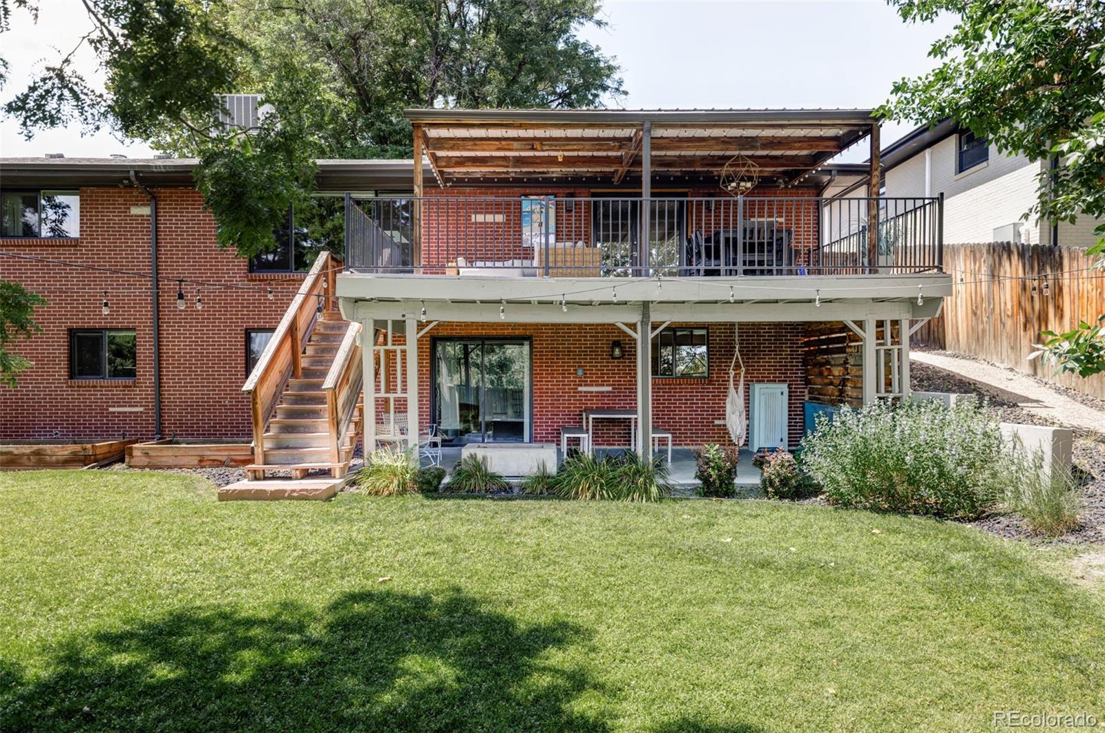 3370 Ward Road Wheat Ridge, CO 80033 - Photo 41 of 42 front view of a house with a yard
