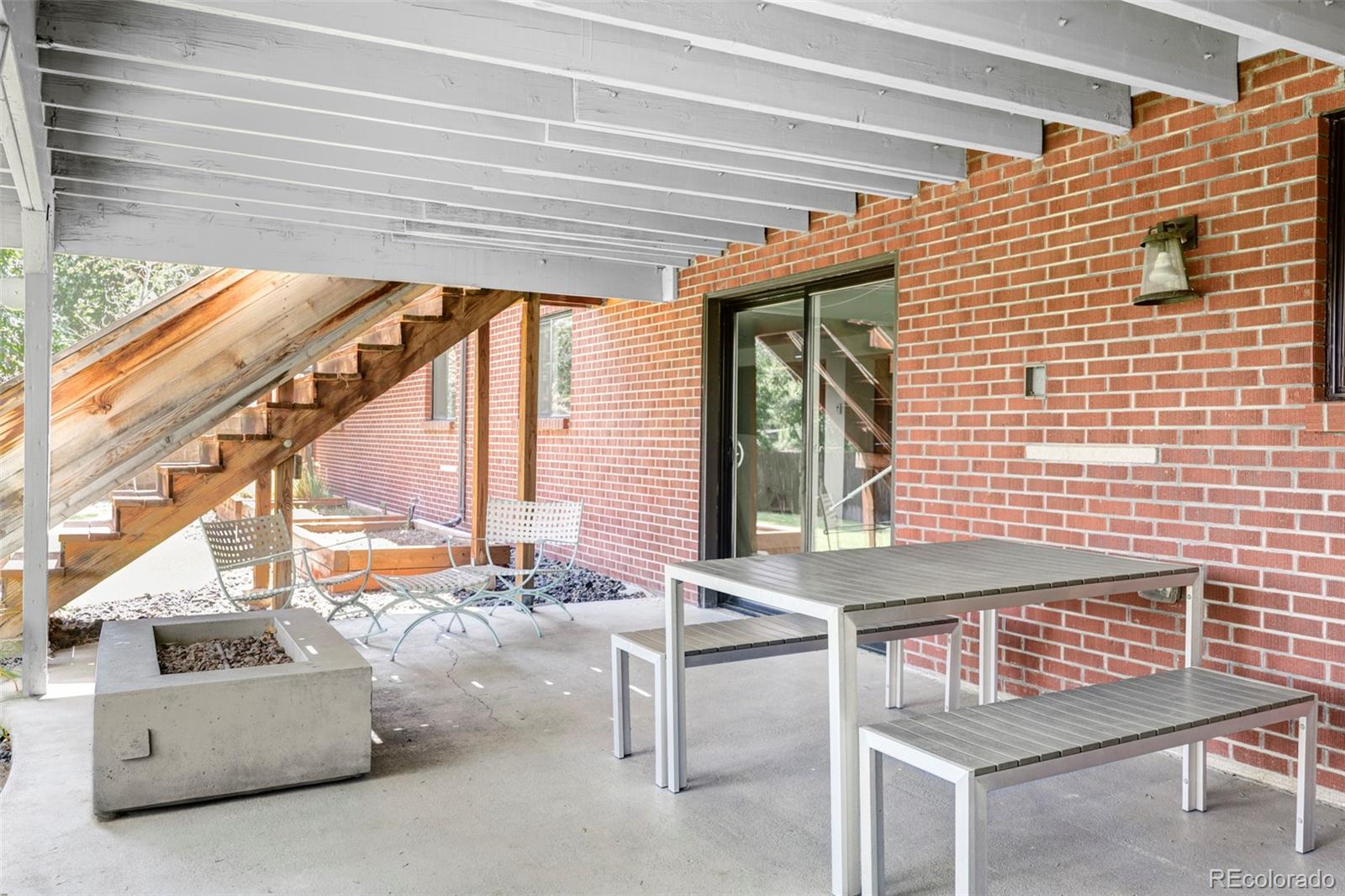 3370 Ward Road Wheat Ridge, CO 80033 - Photo 42 of 42 a backyard of a house with outdoor seating