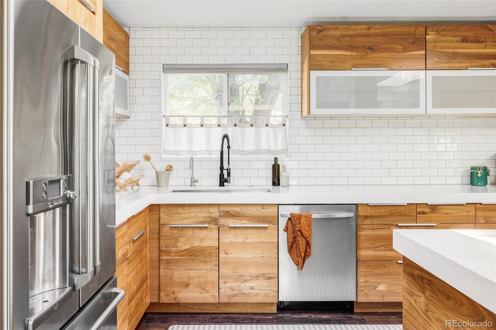 3370 Ward Road Wheat Ridge, CO 80033 - Photo 6 of 42 a view of a kitchen with a window