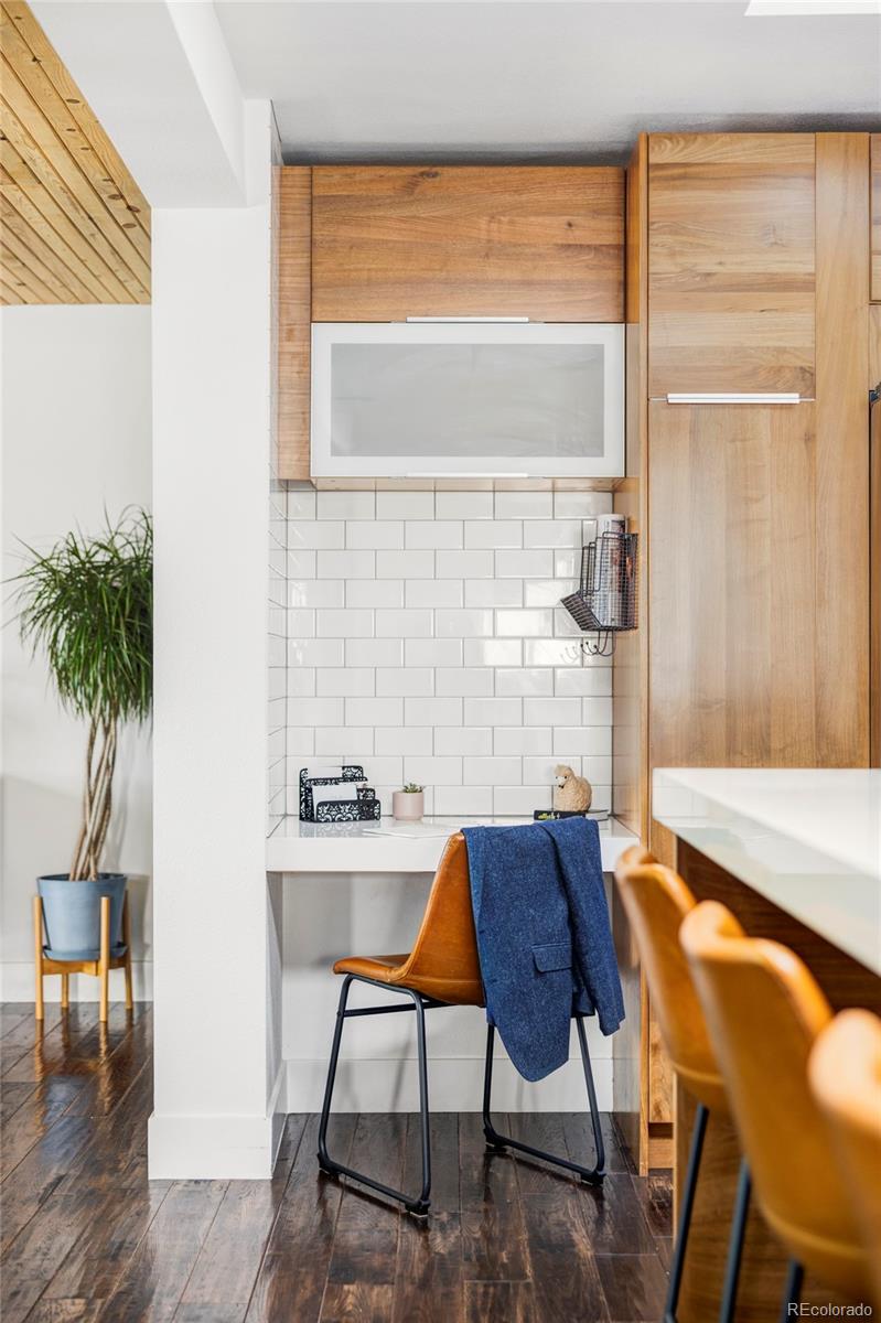 3370 Ward Road Wheat Ridge, CO 80033 - Photo 10 of 42 a view of a dining room with furniture window and wooden floor