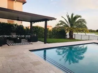 a view of swimming pool with a patio