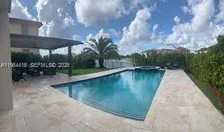 a view of a swimming pool with a patio