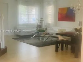 a kitchen with a sink and a refrigerator