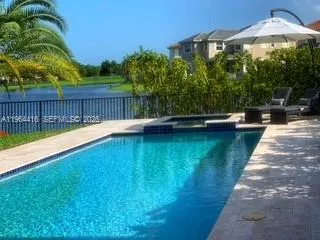 a view of swimming pool with a yard