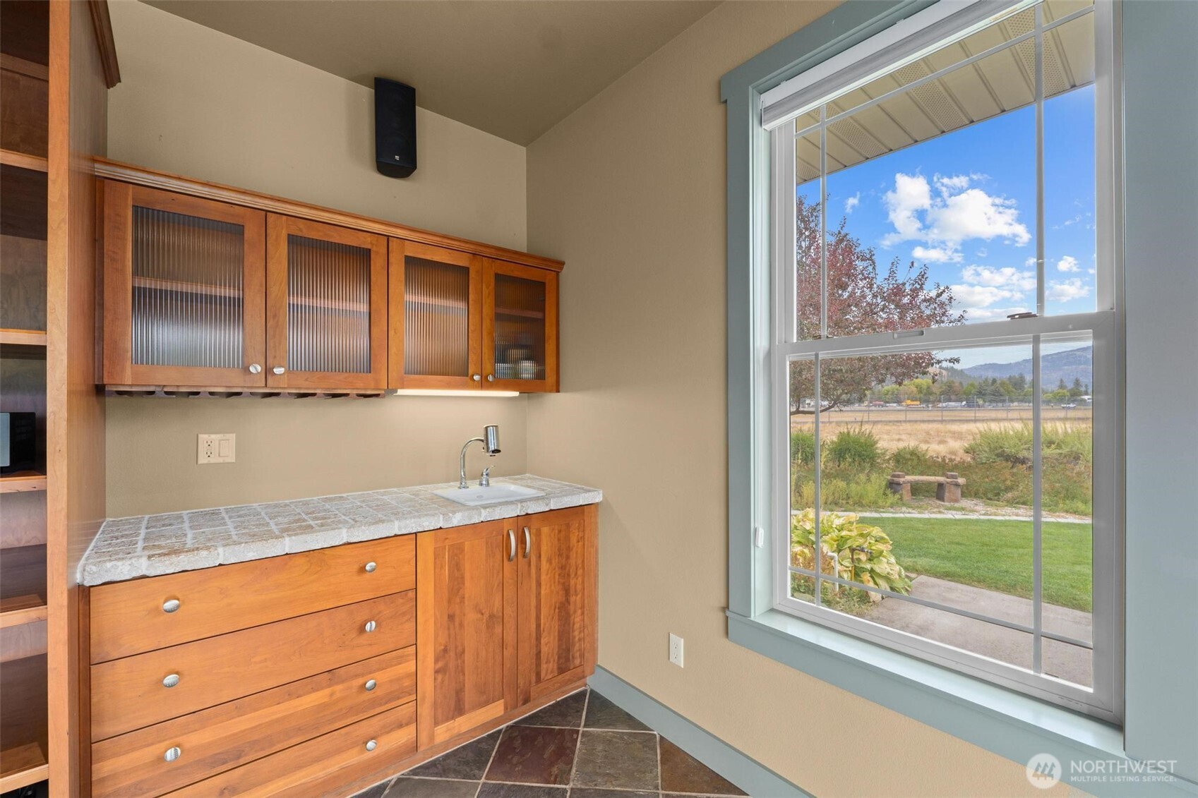 1900 Tamarack Street Colville, WA 99114 - Photo 14 of 40 a view of a kitchen with granite countertop cabinets and outdoor view