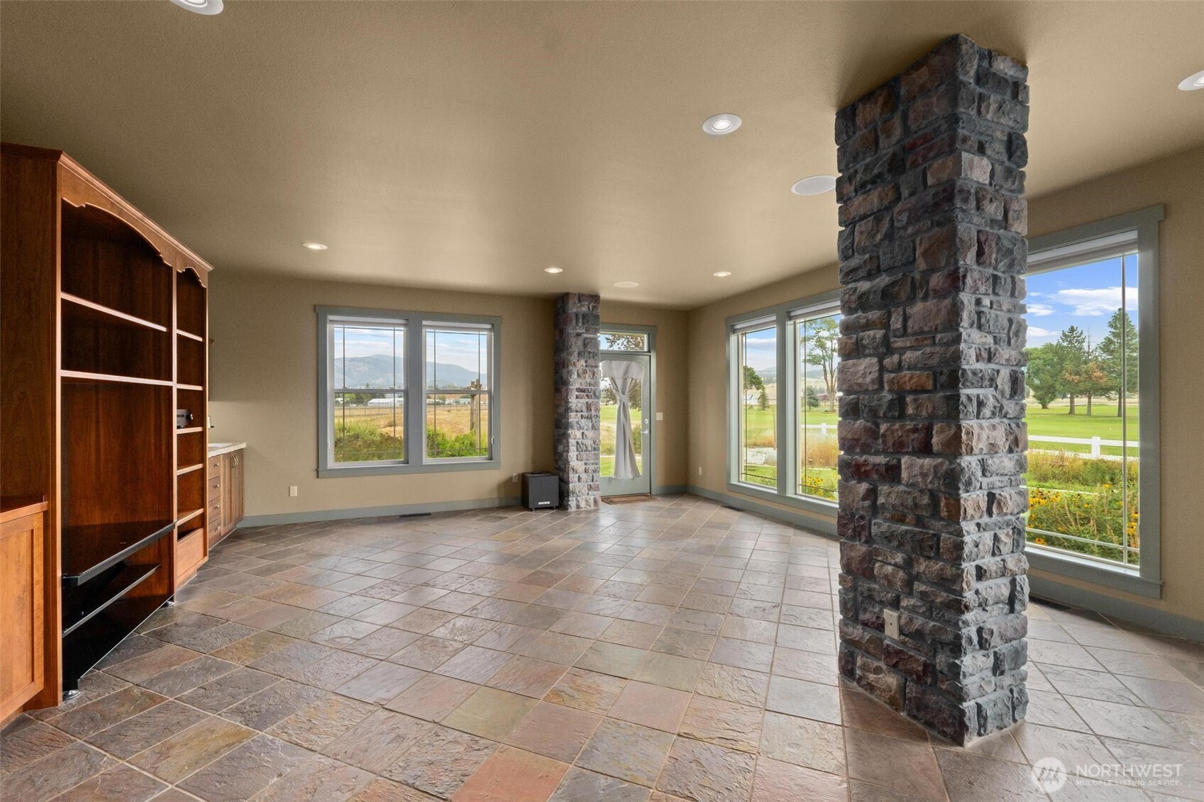 1900 Tamarack Street Colville, WA 99114 - Photo 15 of 40 a view of an empty room with a window and fire place