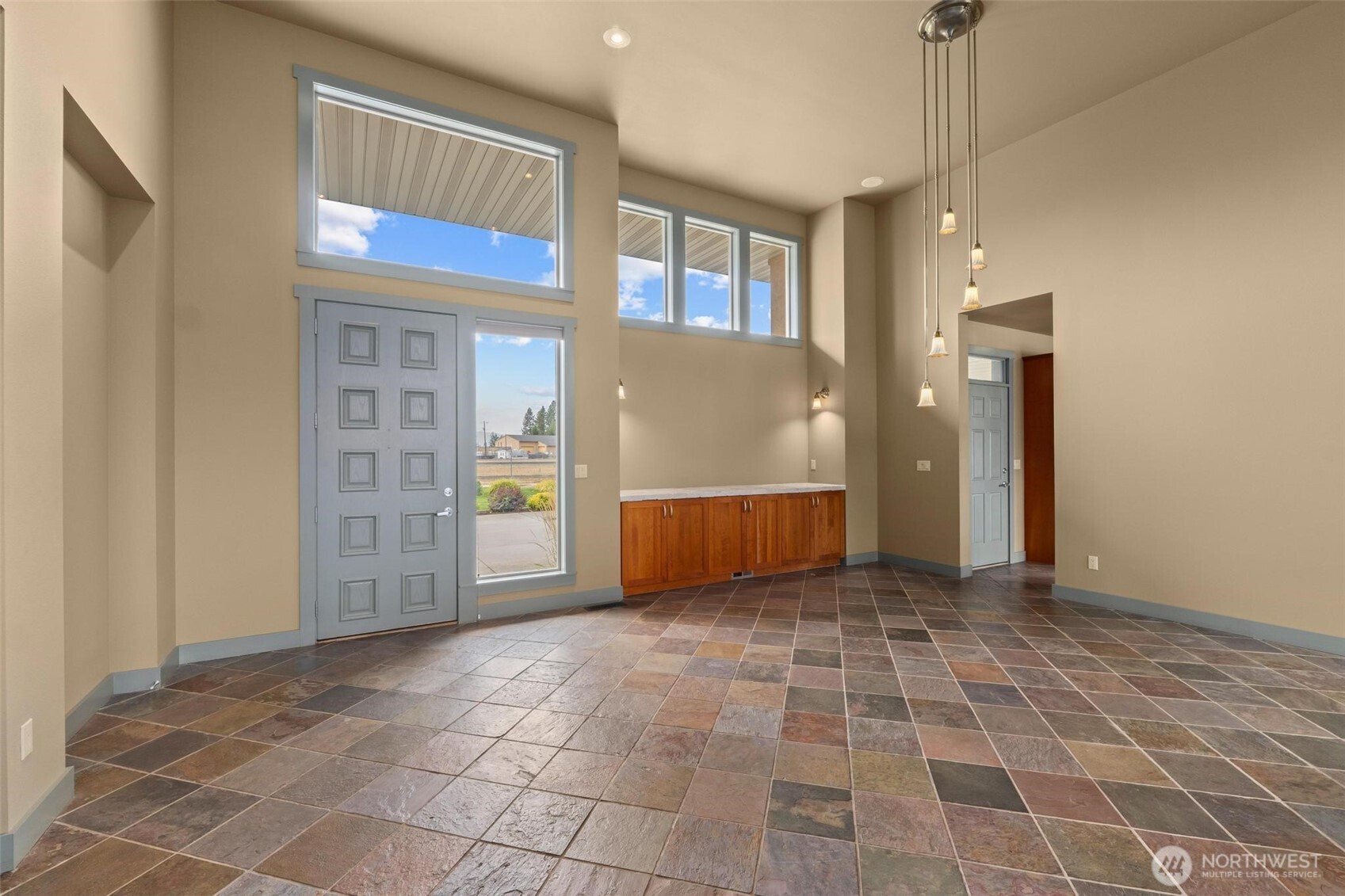 1900 Tamarack Street Colville, WA 99114 - Photo 19 of 40 a view of a hallway with wooden floor and a kitchen