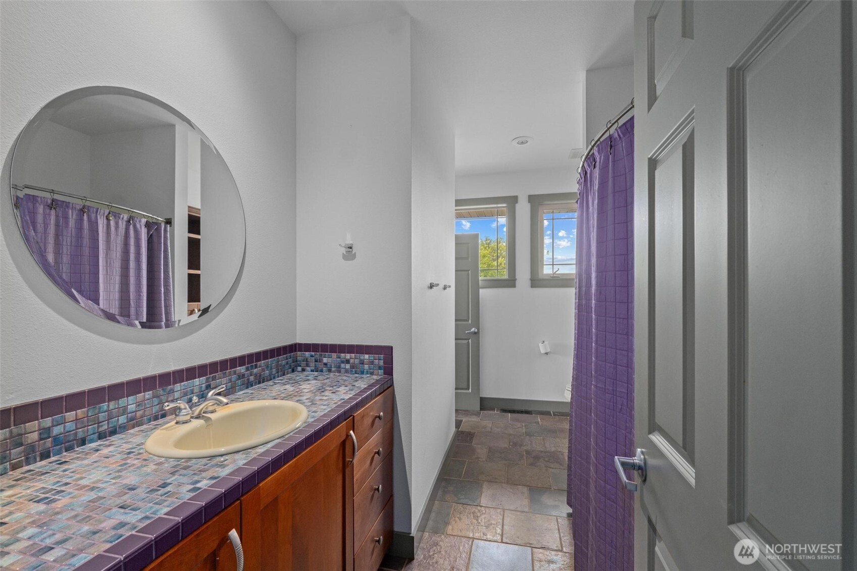 1900 Tamarack Street Colville, WA 99114 - Photo 34 of 40 a bathroom with a granite countertop sink and a mirror