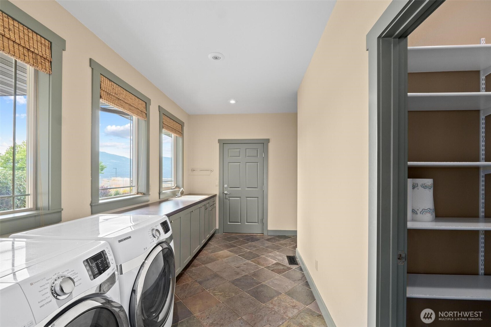 1900 Tamarack Street Colville, WA 99114 - Photo 38 of 40 a bathroom with a tub a sink and a large window