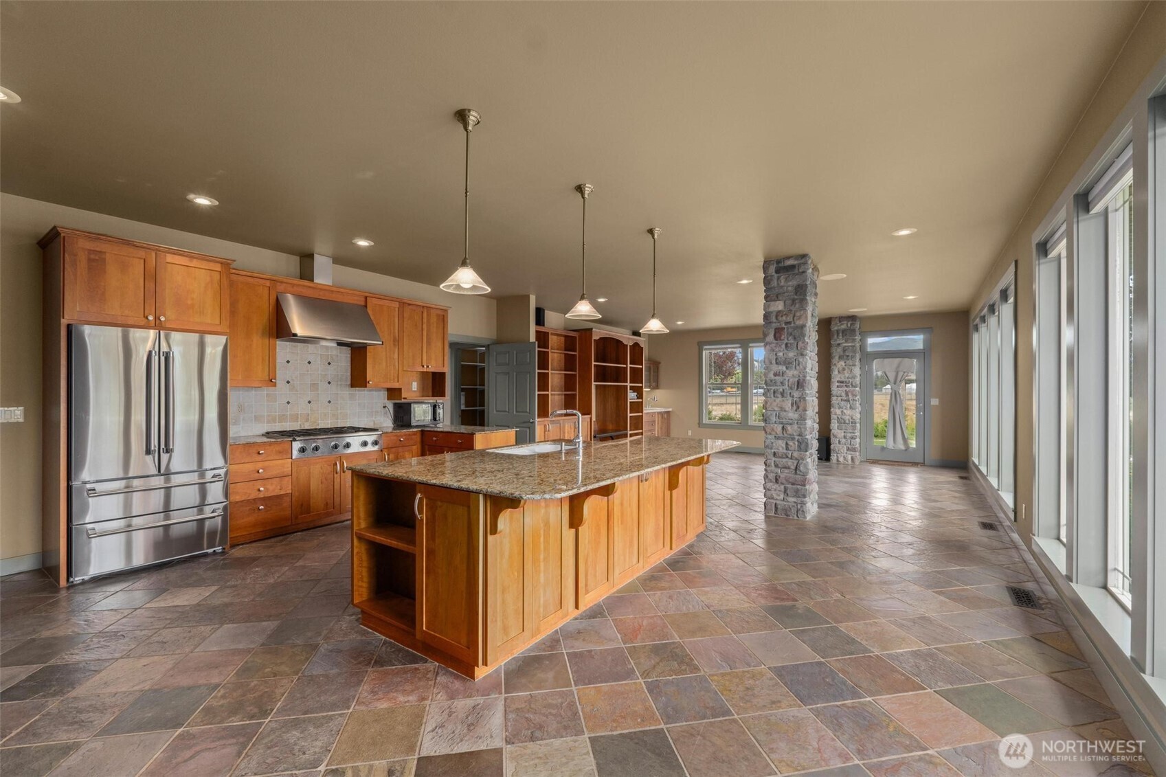 1900 Tamarack Street Colville, WA 99114 - Photo 8 of 40 a large kitchen with kitchen island granite countertop lots of counter top space