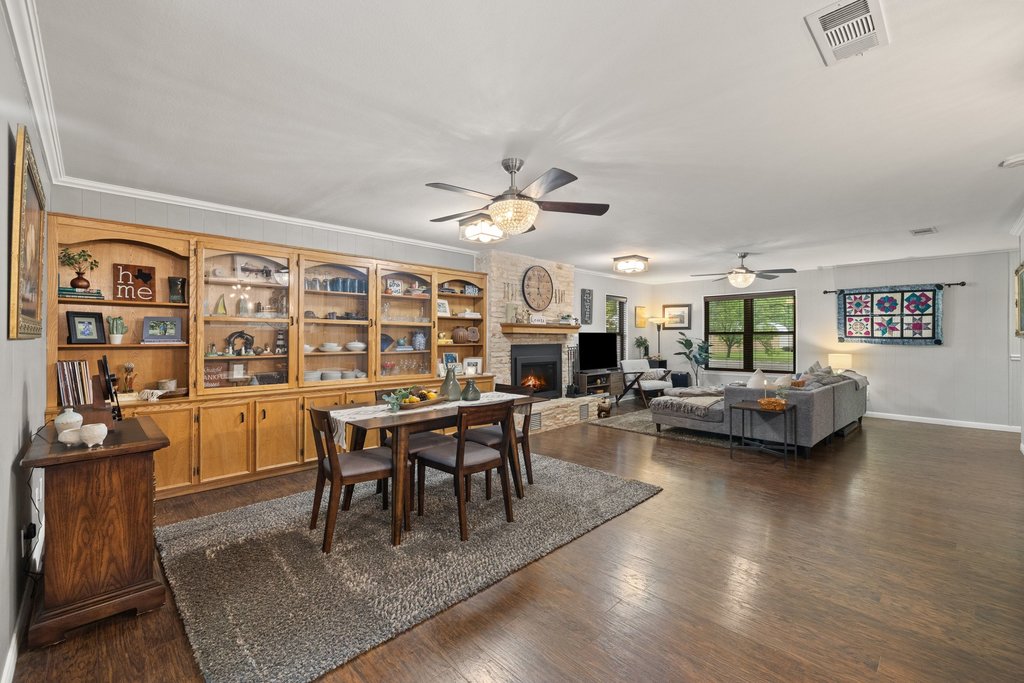 302 South Schramm Road Granger, TX 76530 - Photo 7 of 33 a view of a dining room with furniture window and wooden floor