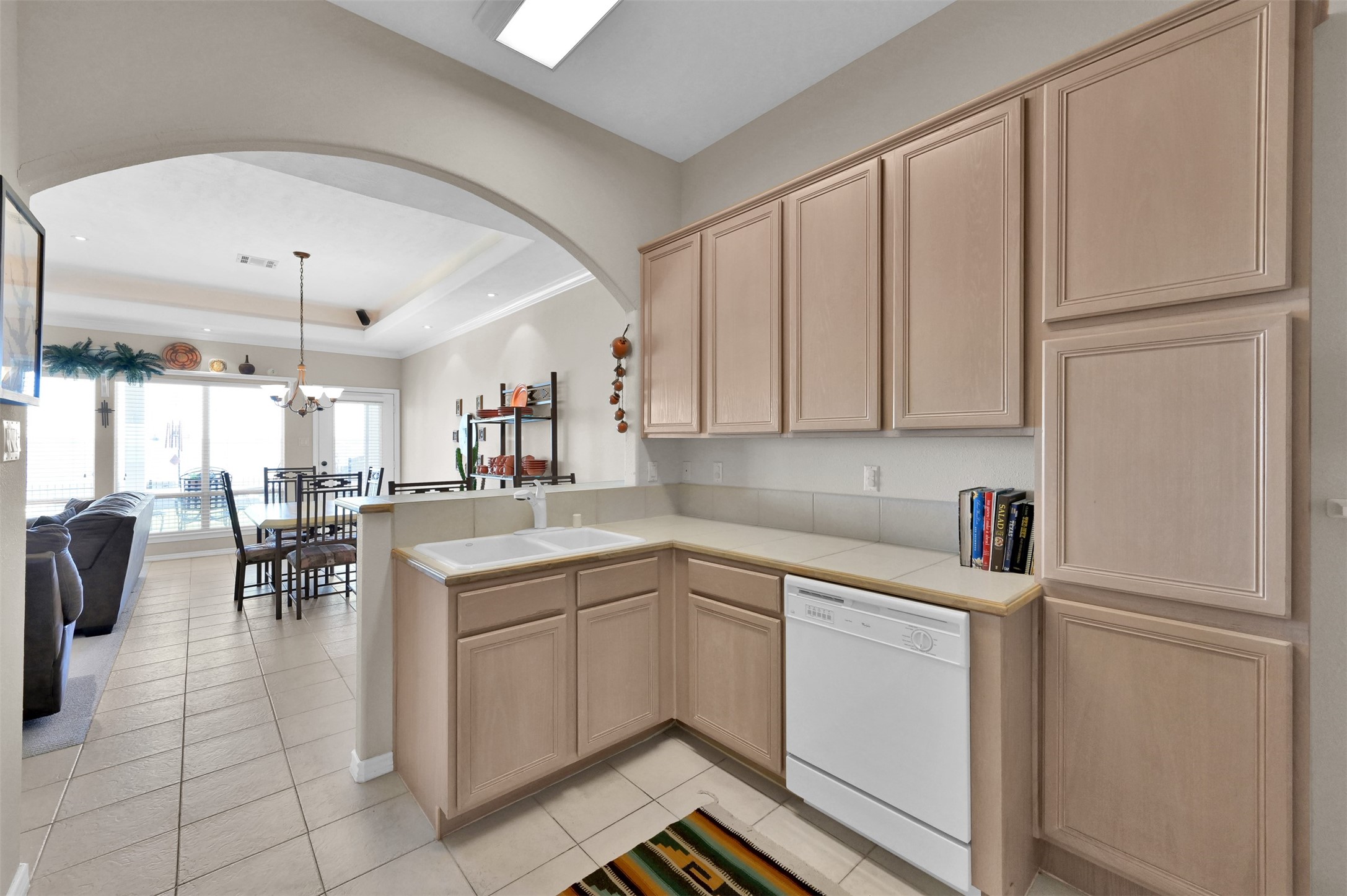 15 Regency Point Conroe, TX 77356 - Photo 11 of 32 a kitchen with white cabinets and white appliances