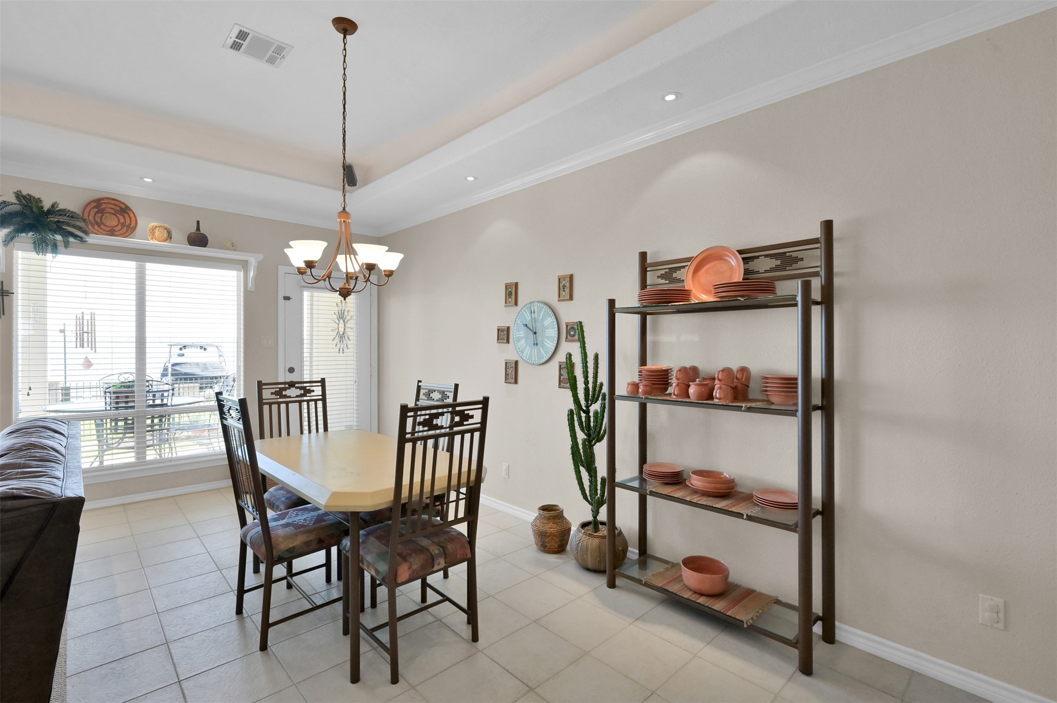 15 Regency Point Conroe, TX 77356 - Photo 12 of 32 a view of a dining room with furniture and a chandelier