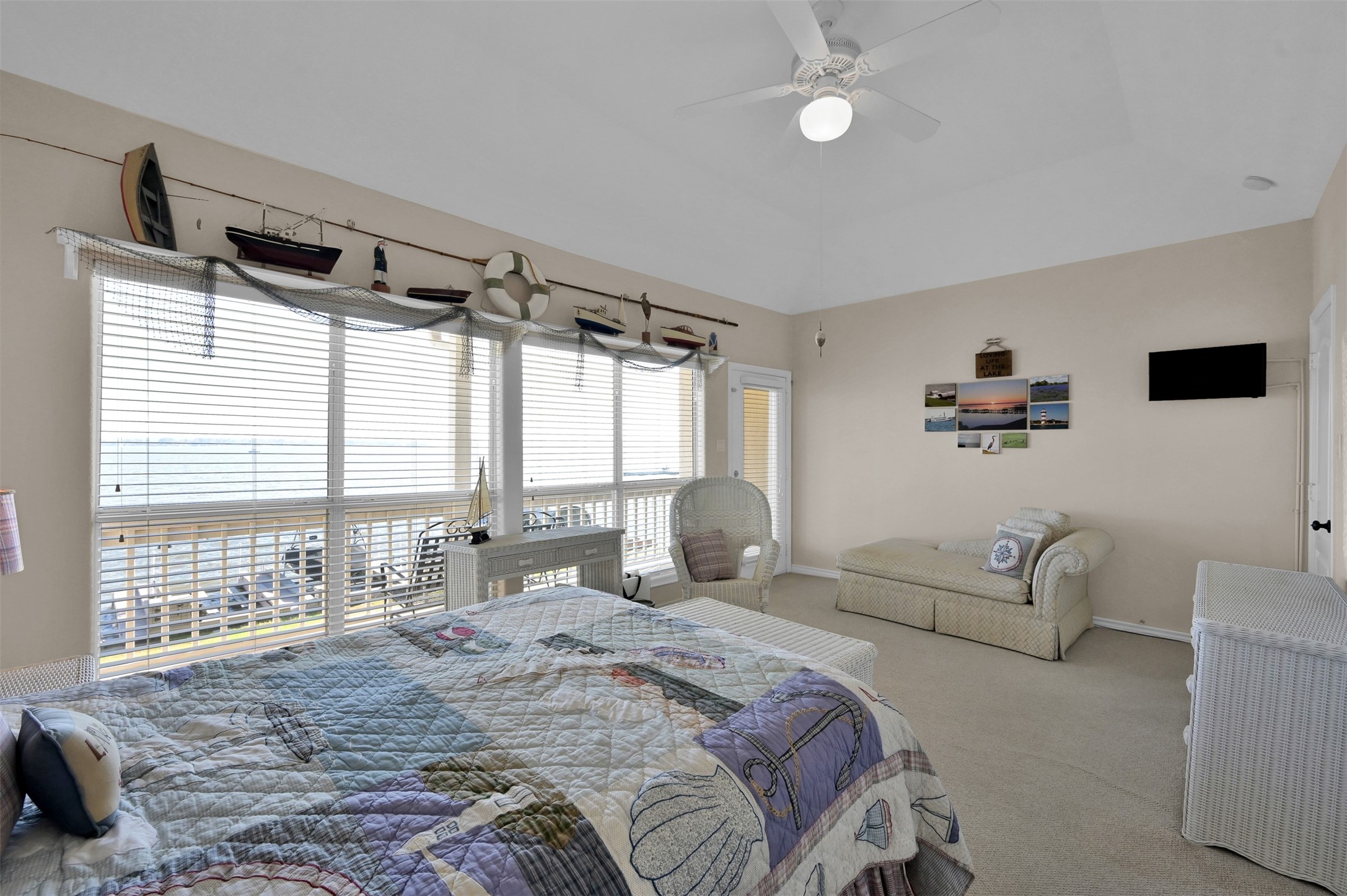 15 Regency Point Conroe, TX 77356 - Photo 15 of 32 a bedroom with a bed couch and large window