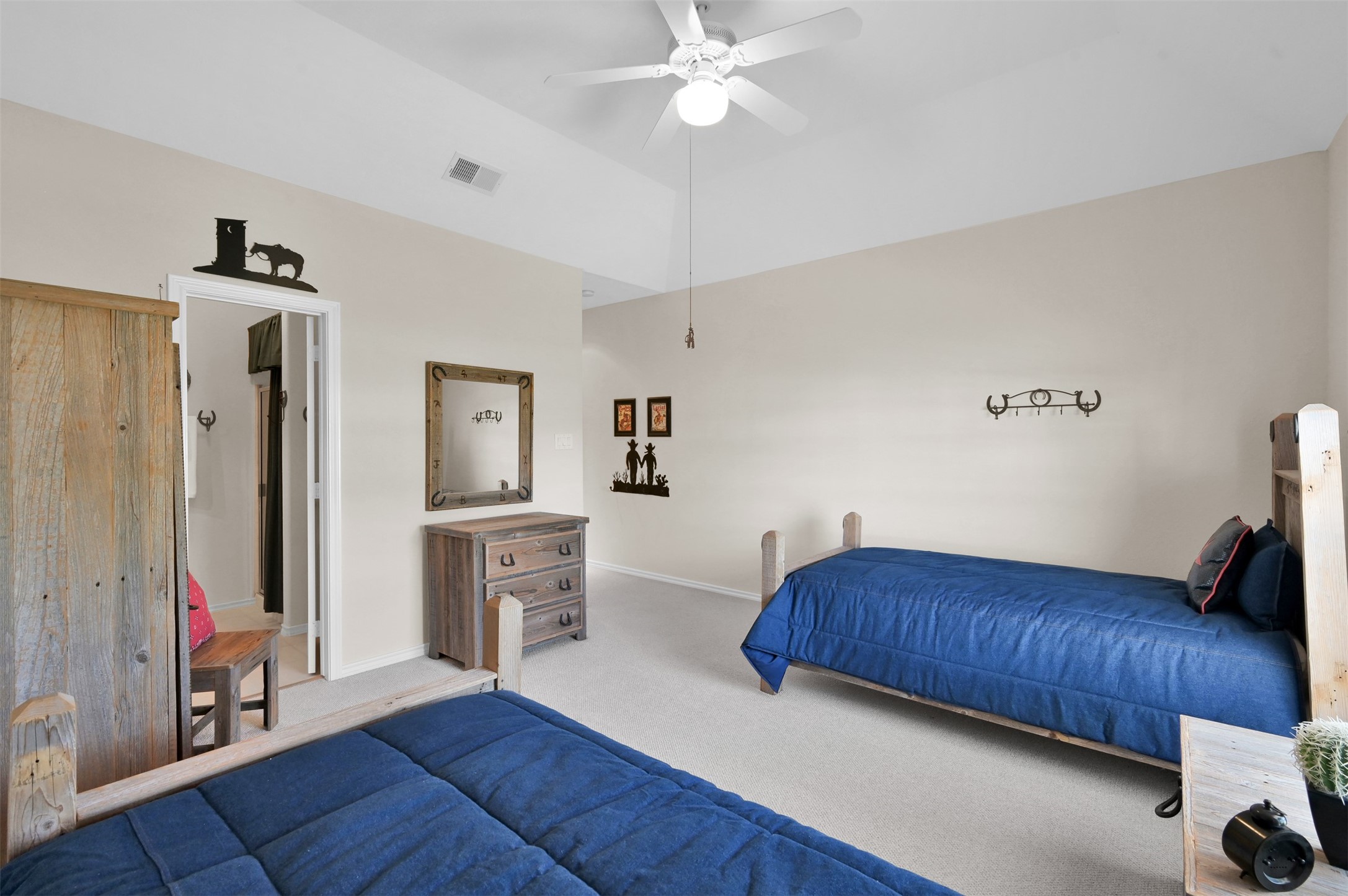 15 Regency Point Conroe, TX 77356 - Photo 20 of 32 a bedroom with furniture and wooden floor