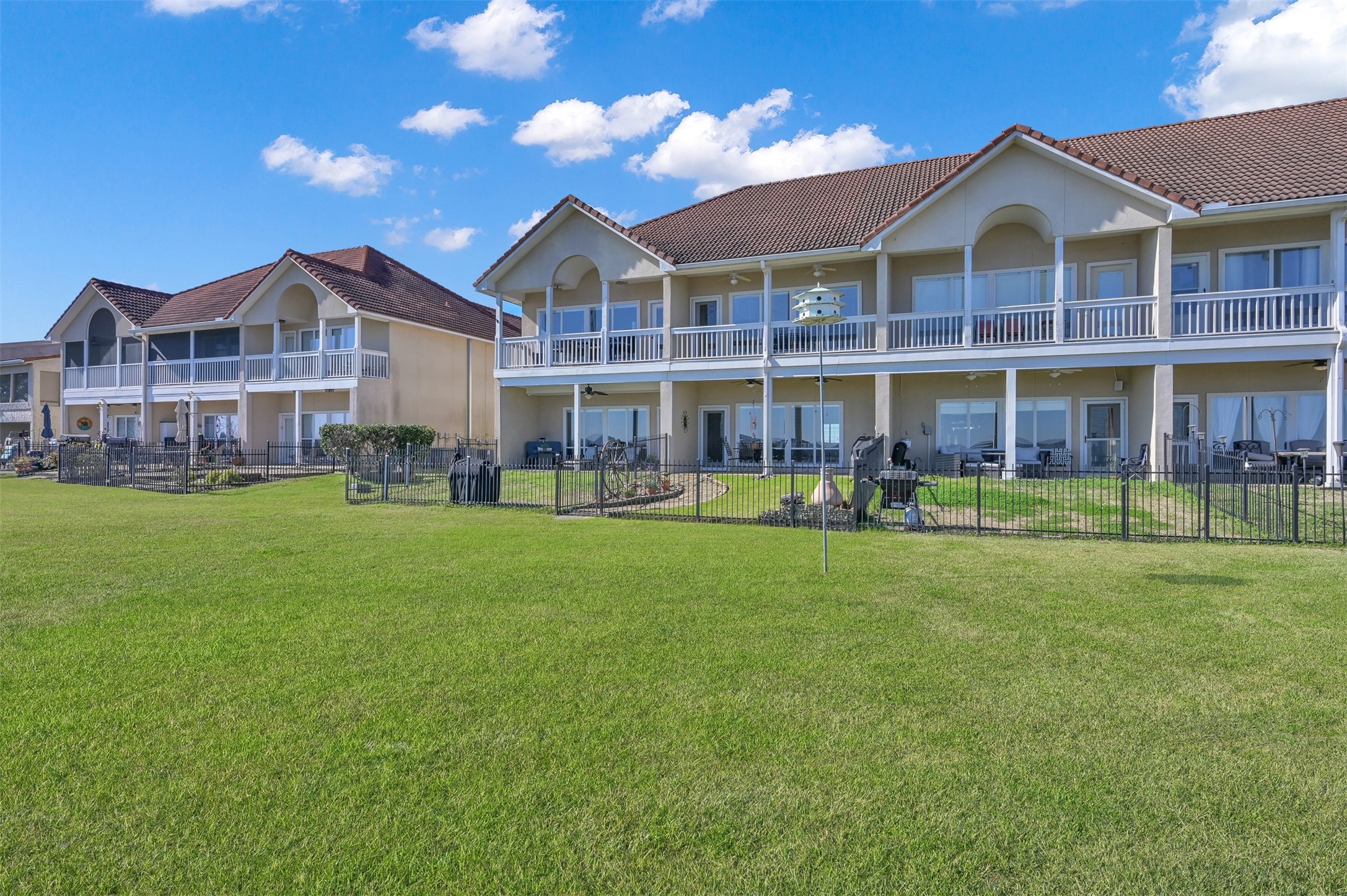15 Regency Point Conroe, TX 77356 - Photo 2 of 32 a front view of a house with a yard table and chairs