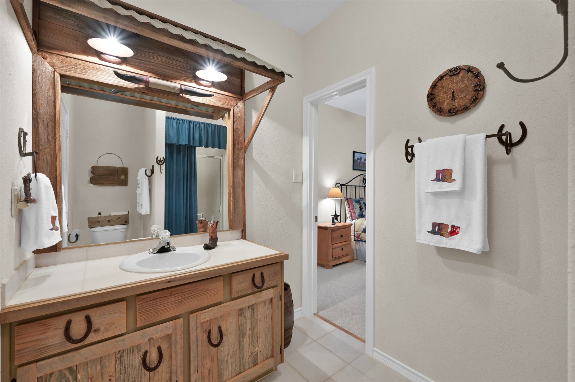 15 Regency Point Conroe, TX 77356 - Photo 21 of 32 a bathroom with a sink and a mirror