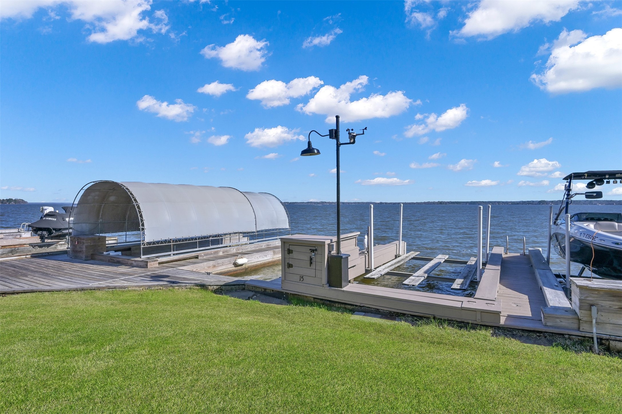 15 Regency Point Conroe, TX 77356 - Photo 26 of 32 a living room with furniture a flat screen tv and lamp