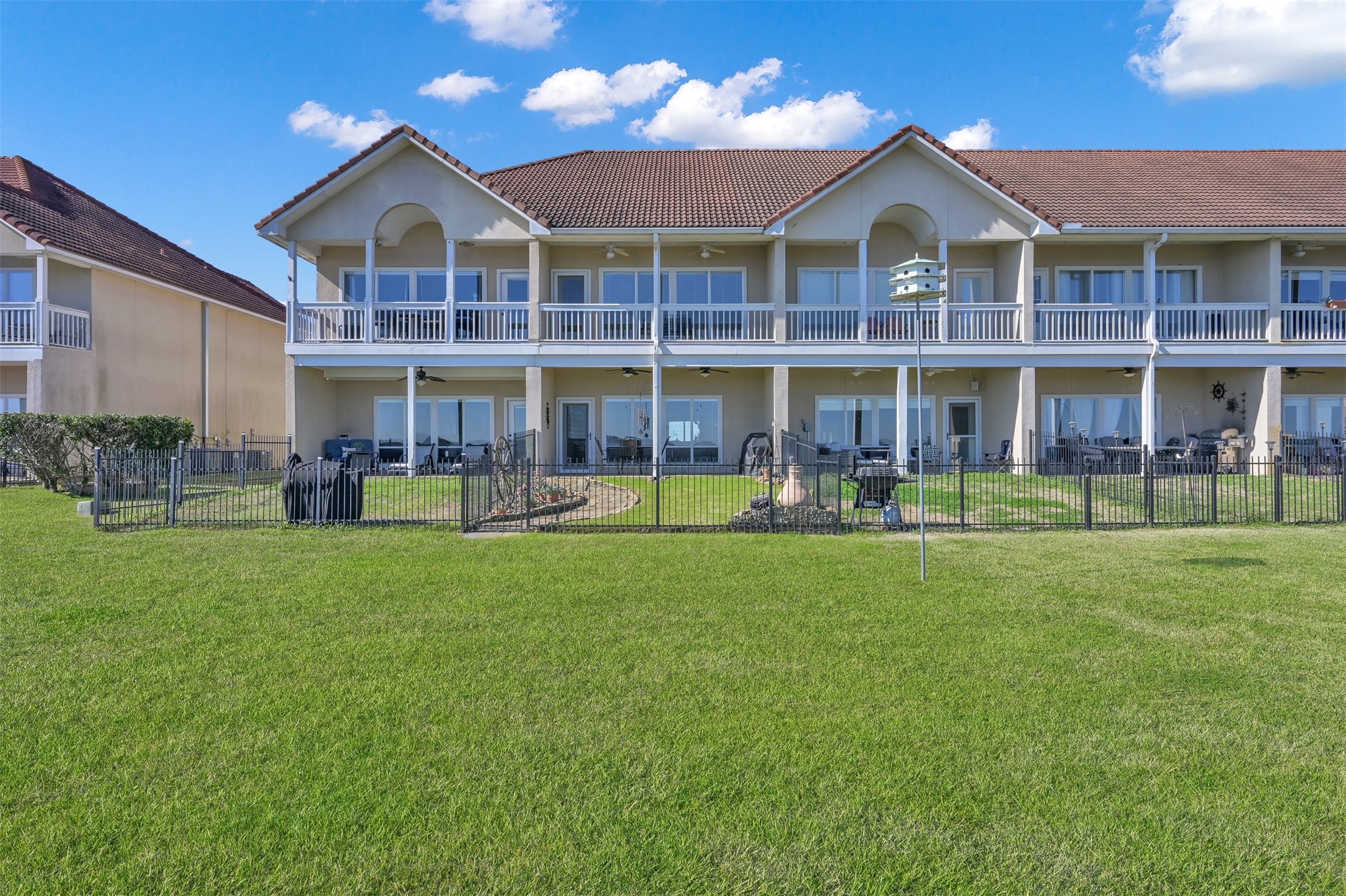 15 Regency Point Conroe, TX 77356 - Photo 32 of 32 a front view of a house with a yard table and chairs