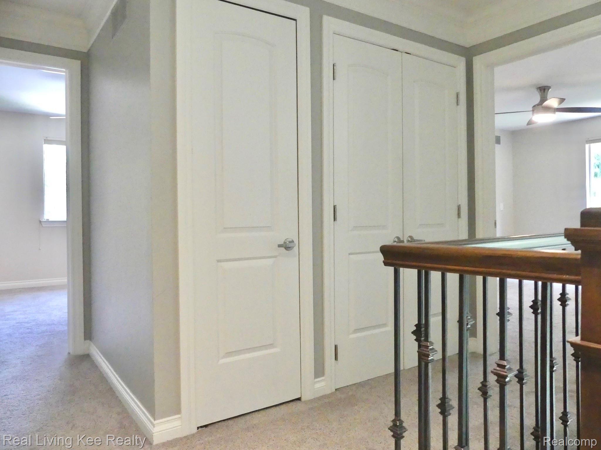 557 Curzon Road Rochester, MI 48307 - Photo 33 of 66 Double storage closets in upstairs hallway