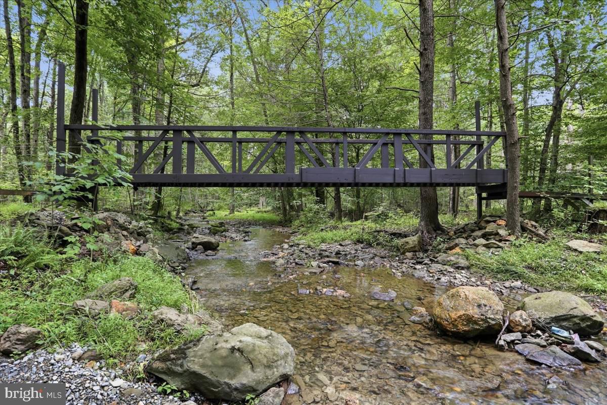 24105 Raven Rock Road Smithsburg, MD 21783 - Photo 4 of 51 Charming bridge over a serene stream.