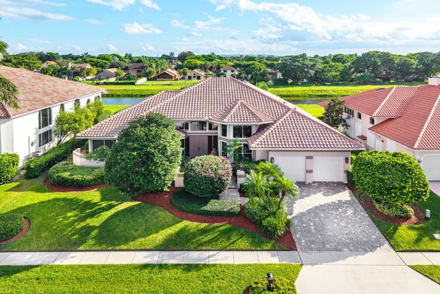 a view of a garden with an ocean view