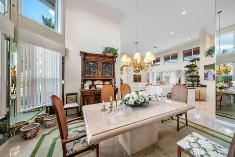 a kitchen with stainless steel appliances granite countertop a refrigerator a oven and a sink