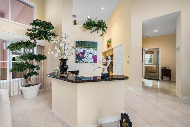 a kitchen with granite countertop a sink and cabinets