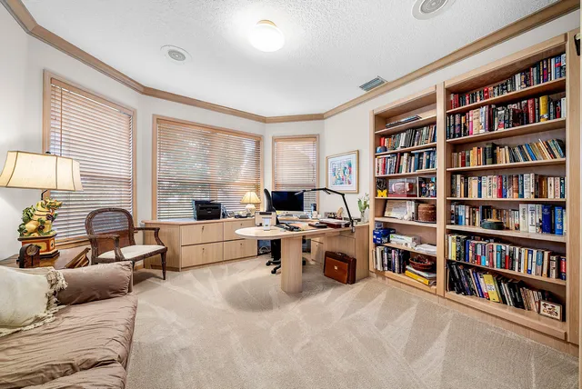 a spacious bedroom with a bed and a couch