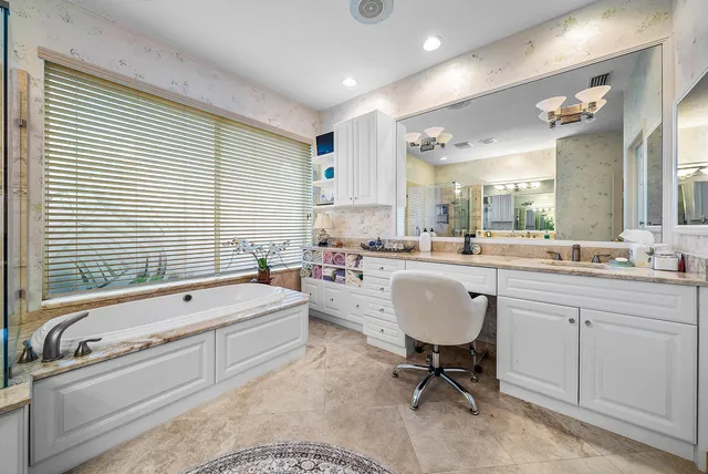 a view of a house with swimming pool and sitting area