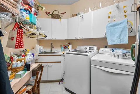 an aerial view of a house with garden space and lake view