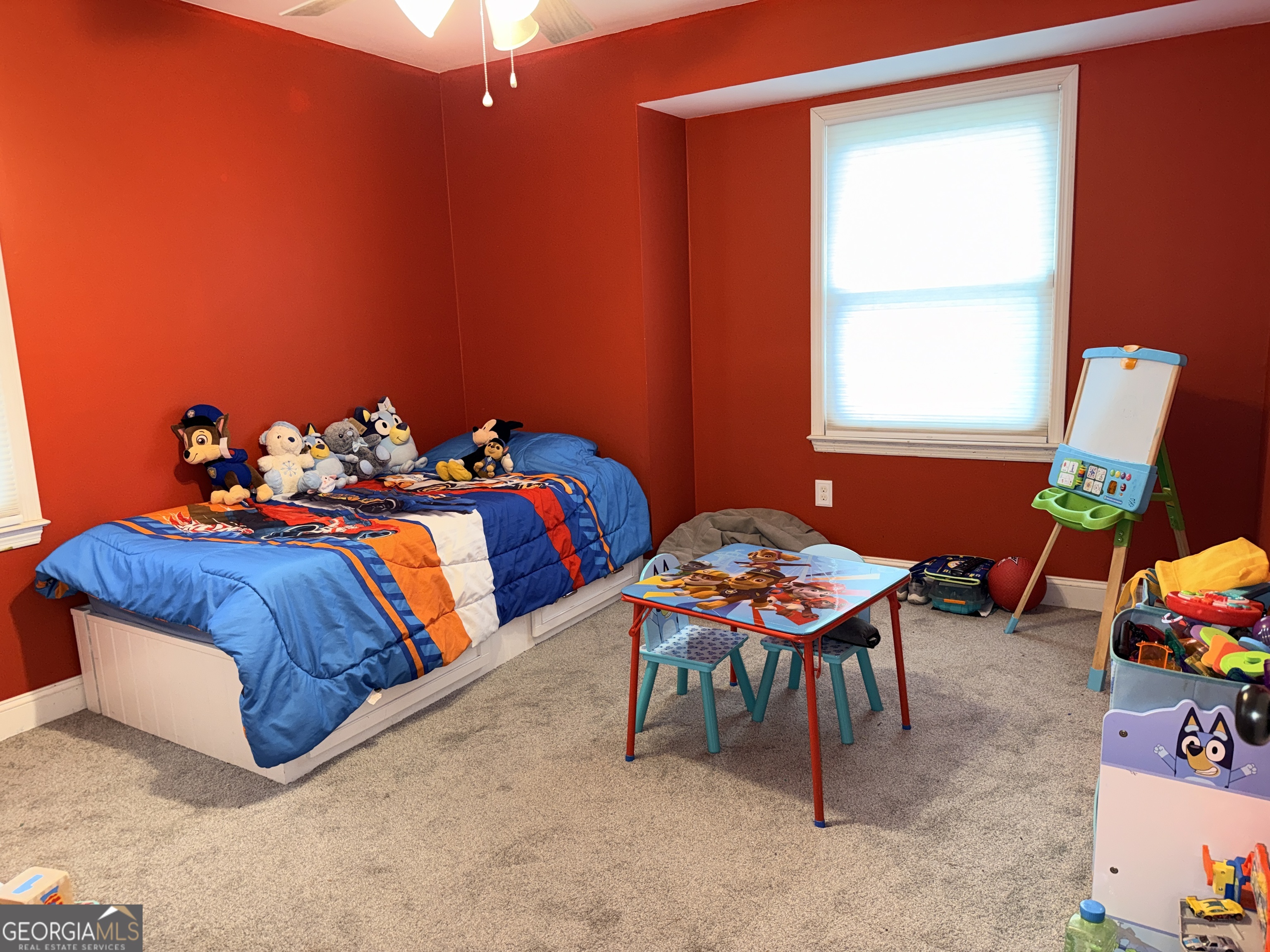 171 Candy Circle Winterville, GA 30683 - Photo 13 of 16 a bedroom with a bed and a window