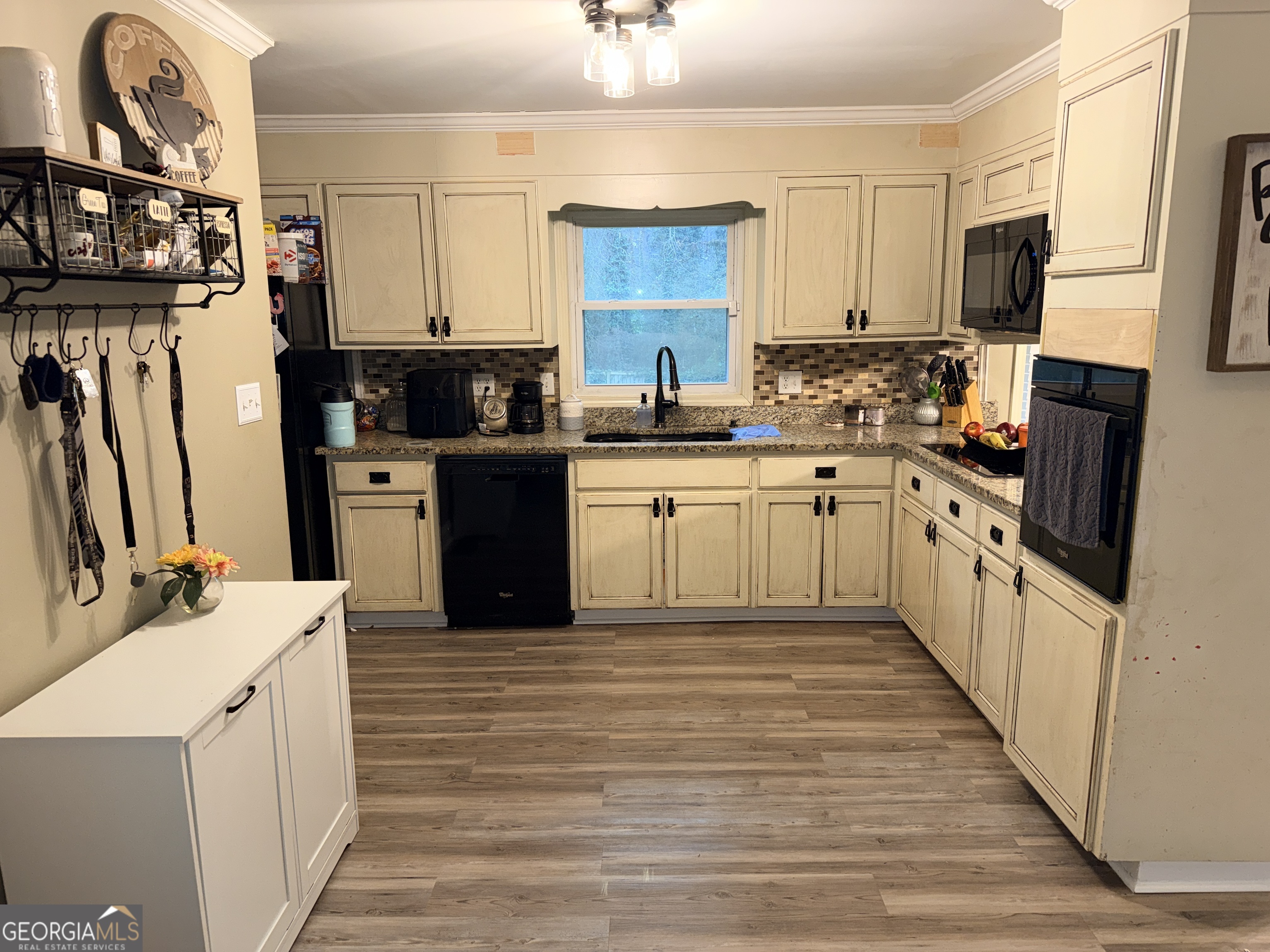 171 Candy Circle Winterville, GA 30683 - Photo 2 of 16 a kitchen with stainless steel appliances granite countertop a stove top oven a sink dishwasher and a refrigerator