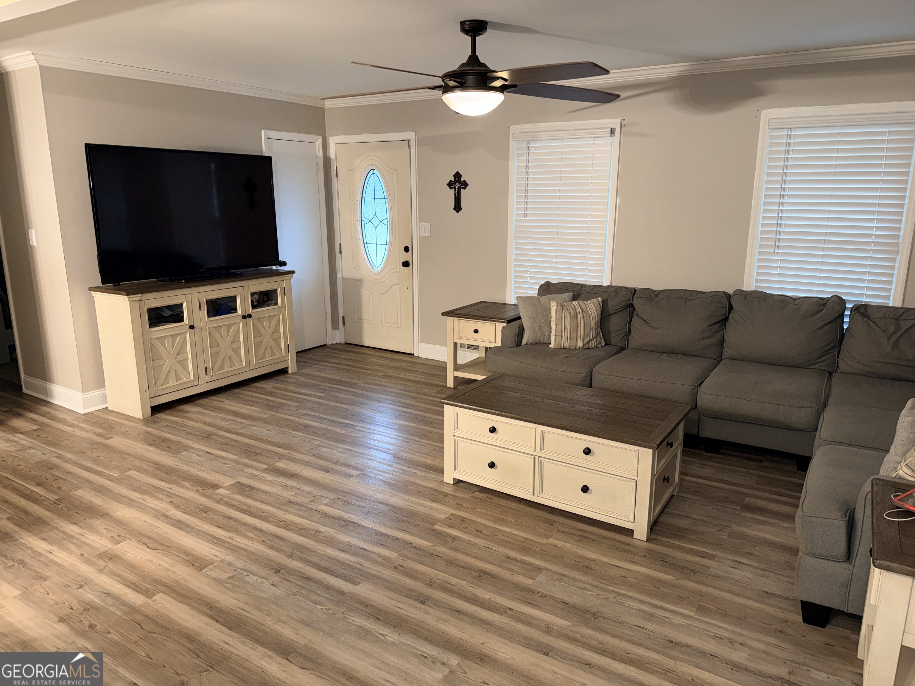 171 Candy Circle Winterville, GA 30683 - Photo 4 of 16 a living room with furniture and a flat screen tv