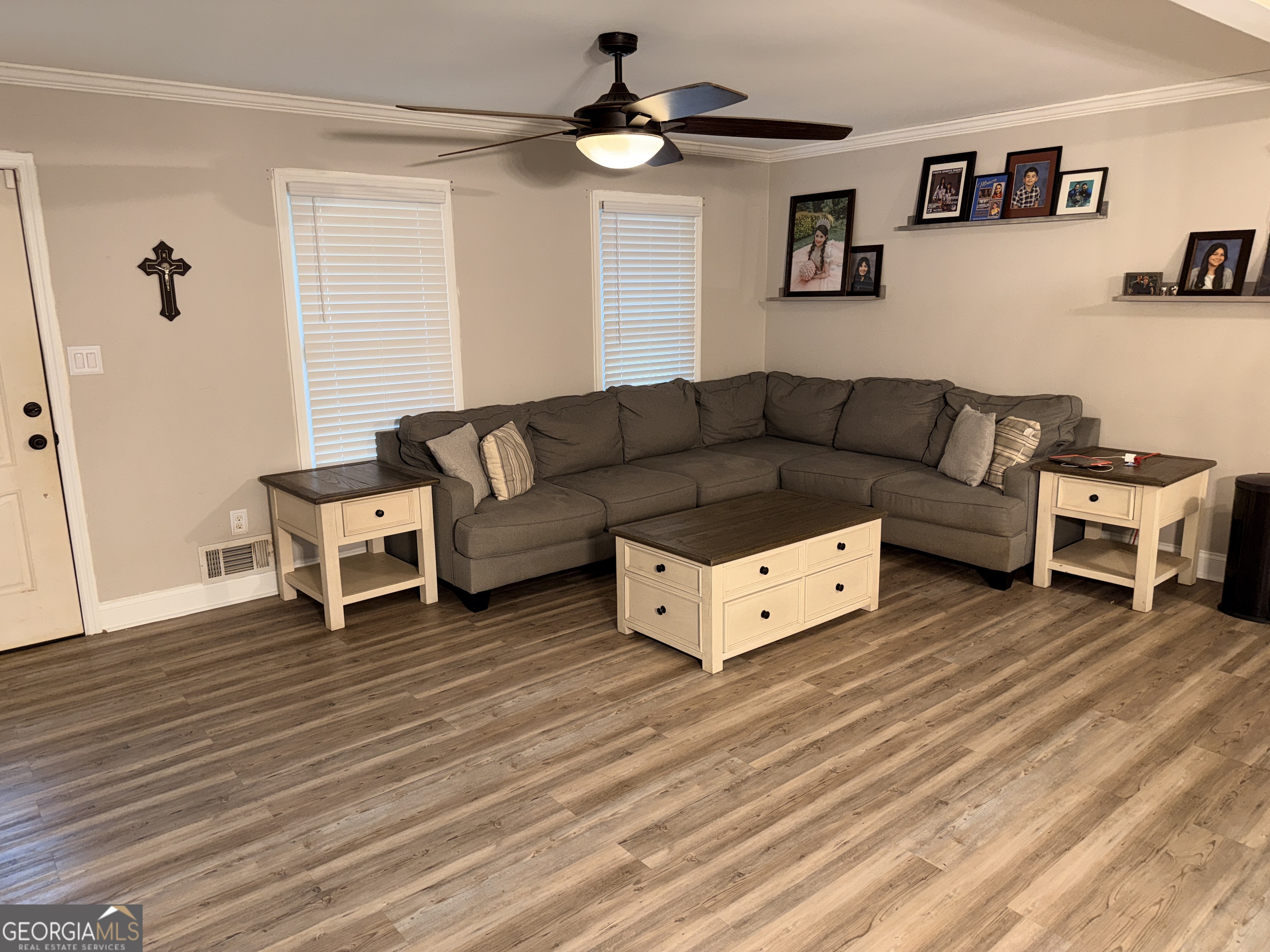 171 Candy Circle Winterville, GA 30683 - Photo 5 of 16 a living room with furniture and a wooden floor