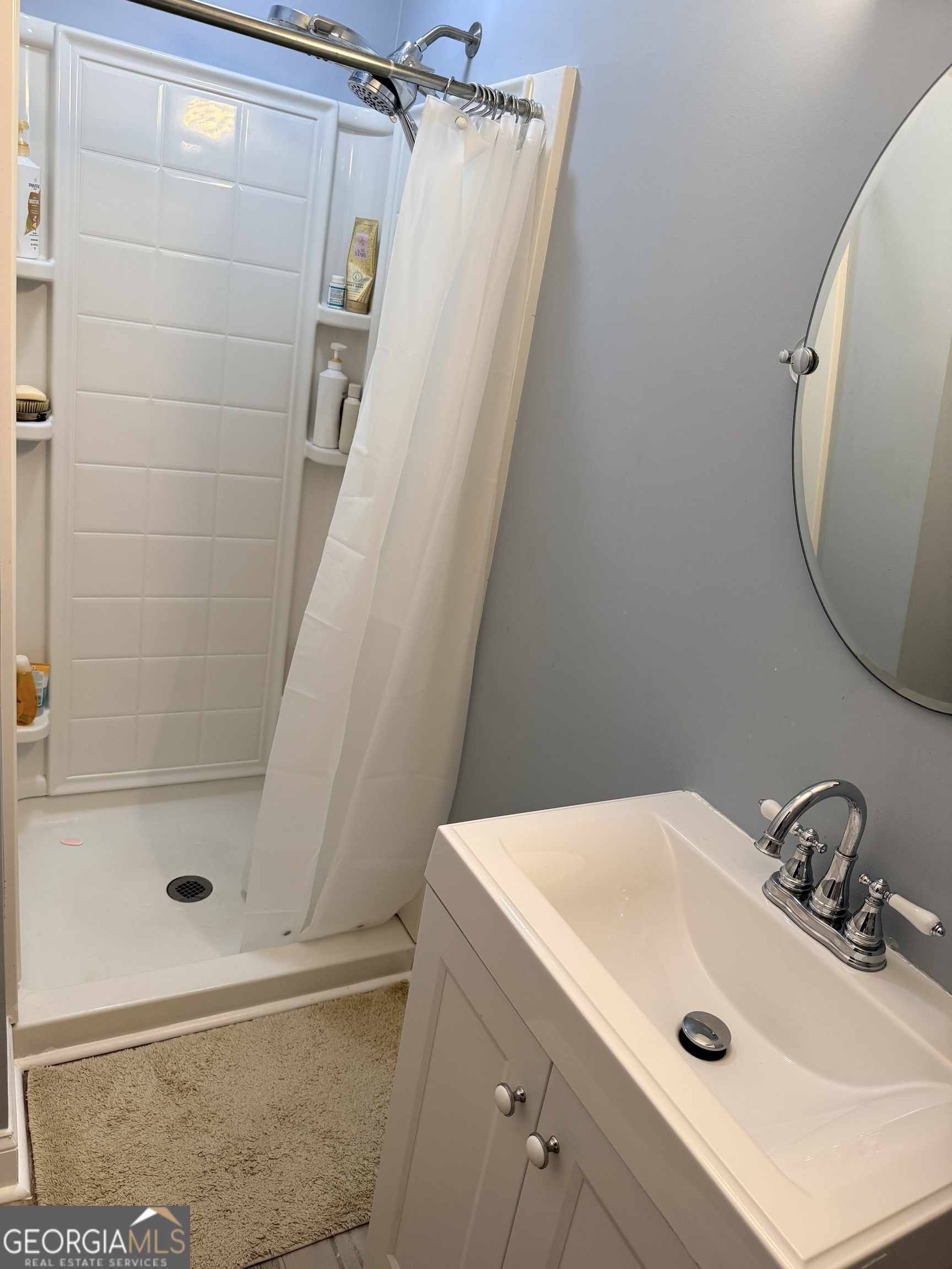 171 Candy Circle Winterville, GA 30683 - Photo 10 of 16 a bathroom with a sink and a mirror