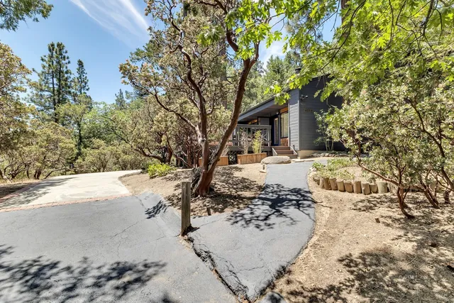an empty room with furniture and a fireplace