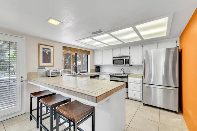 a black and white photo of a refrigerator