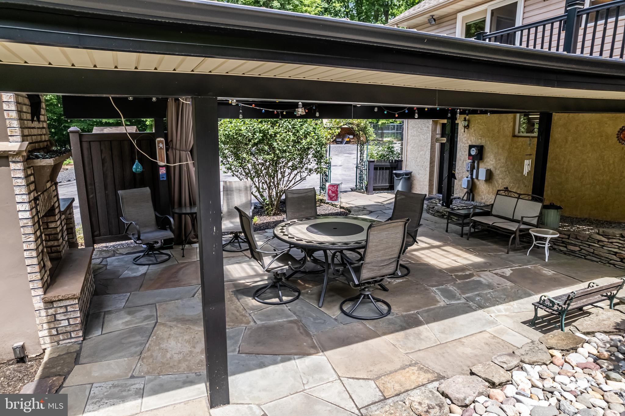 1949 Upper Ridge Road Green Lane, PA 18054 - Photo 47 of 92 Covered rear porch with stone fire place