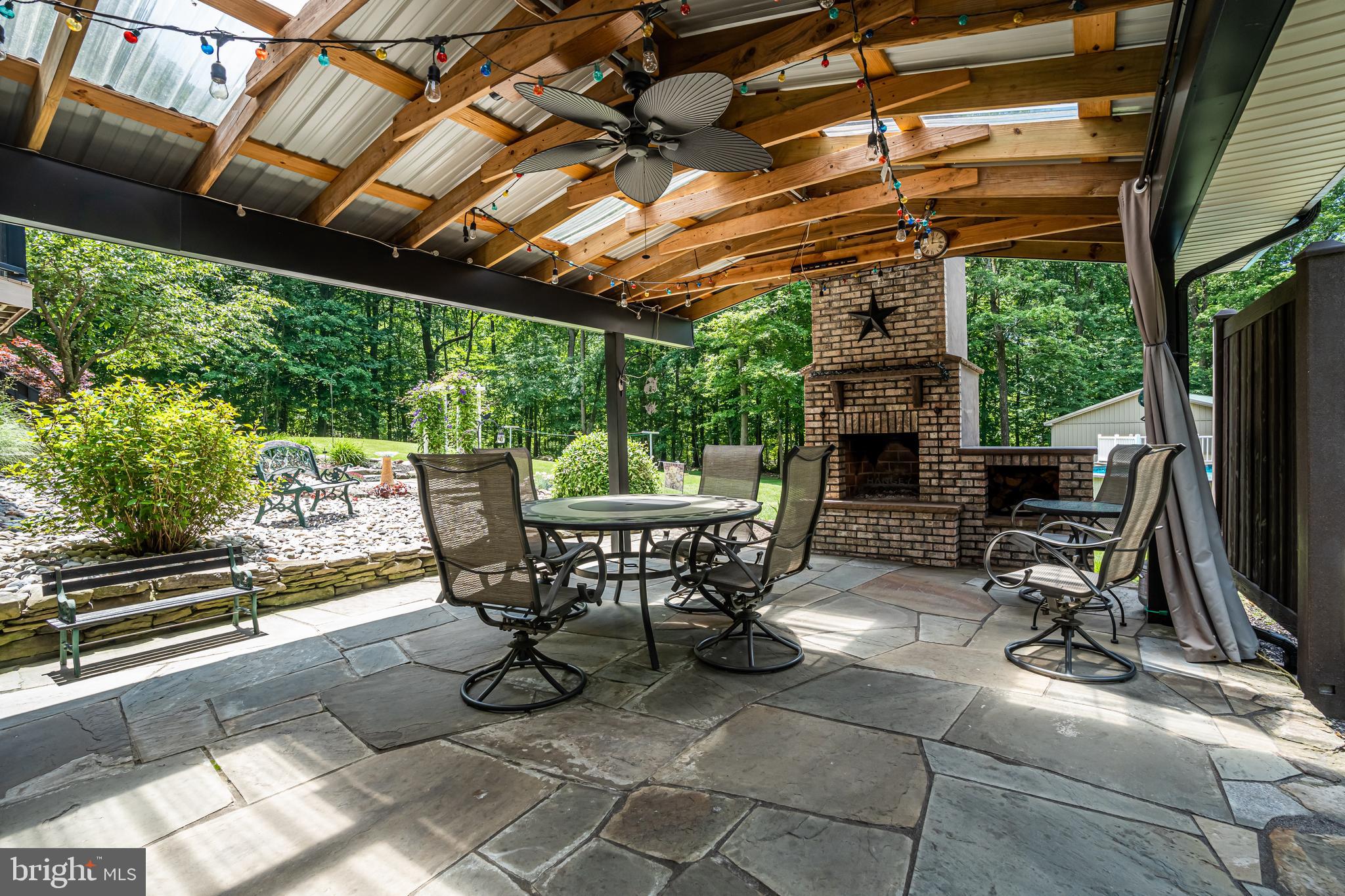 1949 Upper Ridge Road Green Lane, PA 18054 - Photo 49 of 92 Covered rear patio with stne fireplace