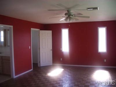 Undisclosed Address Simi Valley, CA 93065 - Photo 4 of 5 an empty room with windows and fan