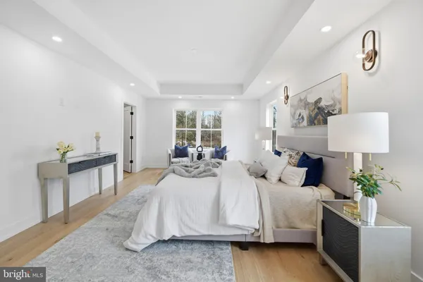 a bedroom with a bed and a table